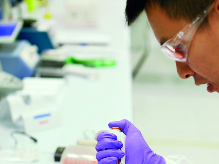 A scientist working in a lab.